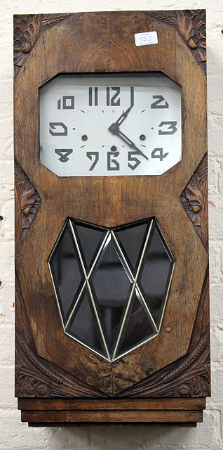 Appraisal: AN ART DECO WALNUT CASED WALL CLOCK the silvered dial