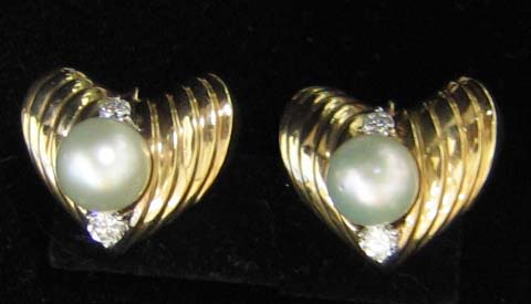 Appraisal: PEARL AND DIAMOND EARRINGS k yellow gold ribbed heart shaped