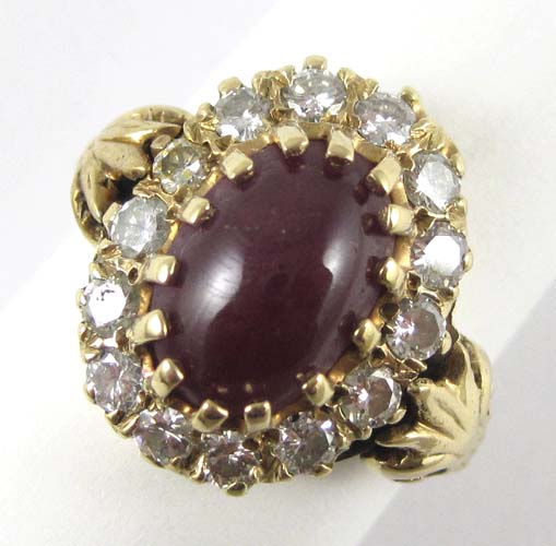 Appraisal: RUBY DIAMOND AND FOURTEEN KARAT GOLD RING with fourteen round-cut