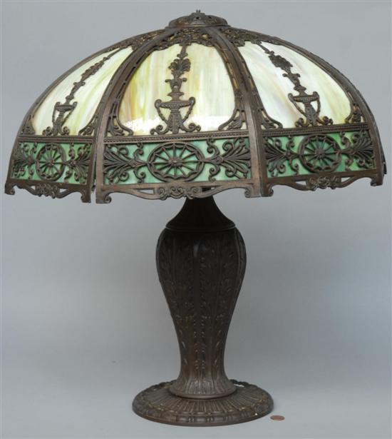 Appraisal: A SLAG GLASS TABLE LAMP WITH RETICULATED DECORATION Some seperation