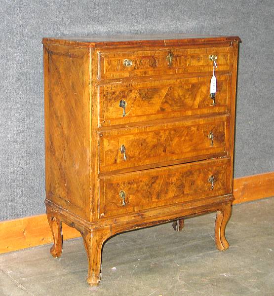 Appraisal: An Italian Rococo style walnut chest of drawers height in