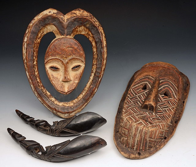 Appraisal: AN AFRICAN CARVED WOODEN EKUK MASK for the Kwele tribe