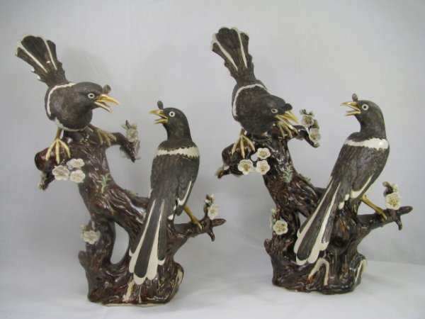 Appraisal: Pair of Chinese porcelain hand painted Magpie bird figurines perched