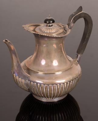 Appraisal: A late Victorian silver hot water jug London of half-reeded