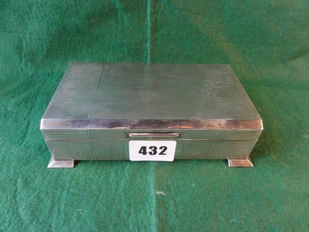 Appraisal: A silver cigarette box with engine turned lid and sides