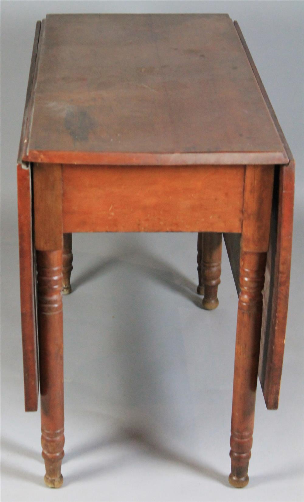 Appraisal: AMERICAN LATE SHERATON CHERRY DROP LEAF TABLE having a rectangular