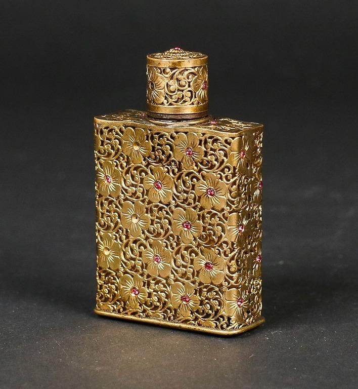 Appraisal: Schiaparelli Shocking clear glass perfume bottle gilt metal filigree casing