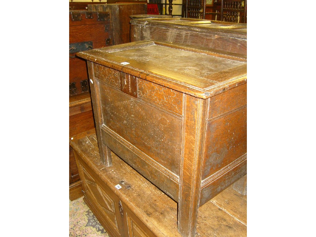 Appraisal: A small Georgian oak coffer with panelled frame and simple