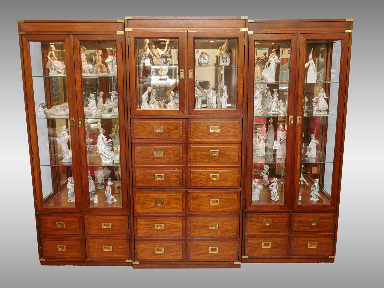 Appraisal: LARGE THREE SECTION CURIO CABINET Campaign style three section curio