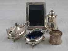 Appraisal: A three piece silver condiment set with blue glass liners