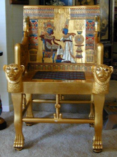 Appraisal: CONTEMPORARY EGYPTIAN KING TUT STYLE THRONE CHAIR Classic carved figures