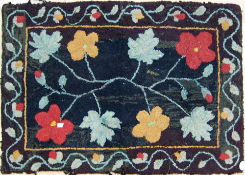 Appraisal: Hooked rug with floral decoration early th c ' x