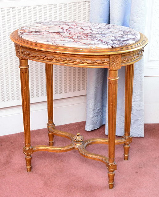 Appraisal: A FRENCH GILT OVAL OCCASIONAL TABLE with inset marble top