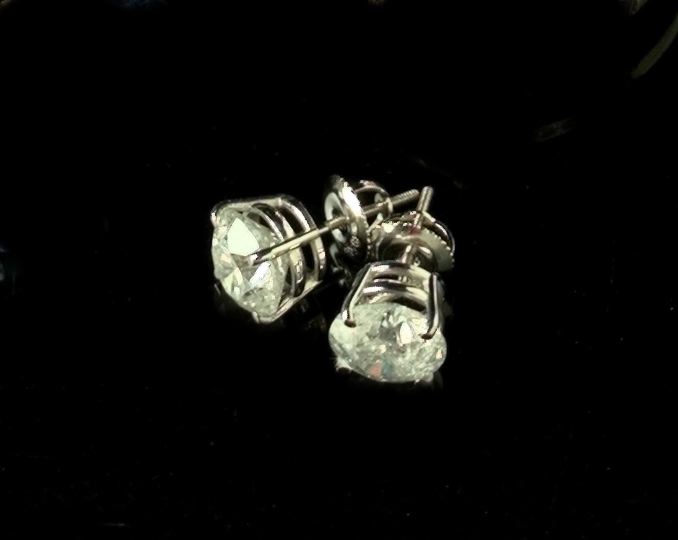 Appraisal: Pair of Fourteen-Karat White Gold and Diamond Solitaire Earrings total