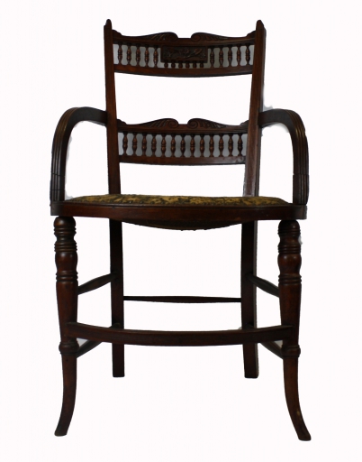 Appraisal: Aesthetic carved walnut spindle back armchair with needlepoint seat