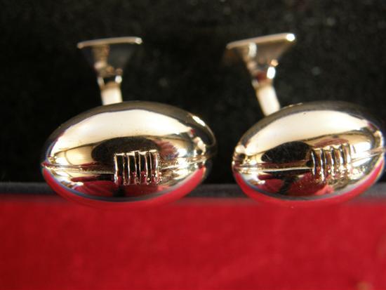 Appraisal: Sterling silver pair of rugby ball cufflinks