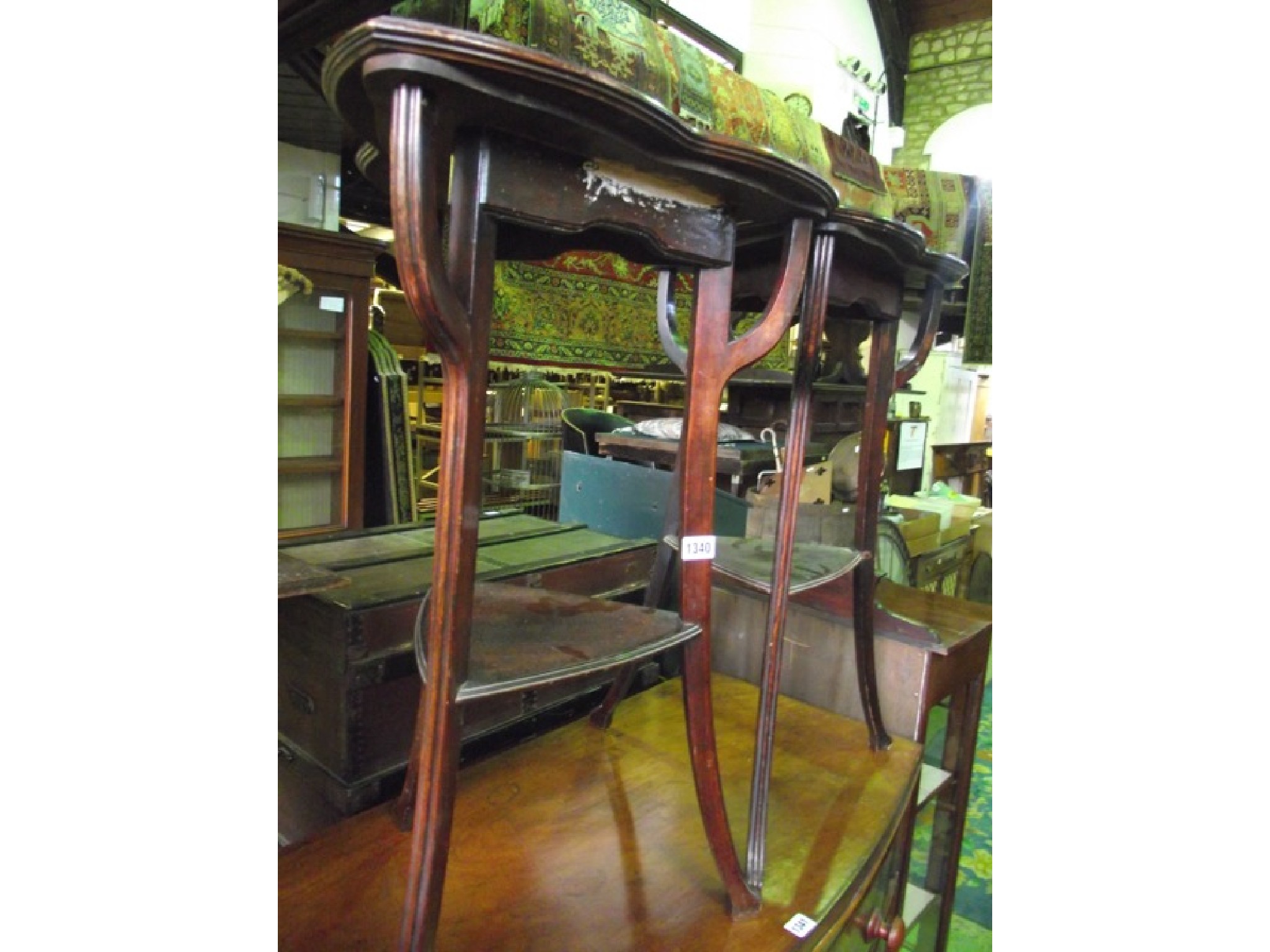 Appraisal: A pair of Art Nouveau walnut two tier occasional tables