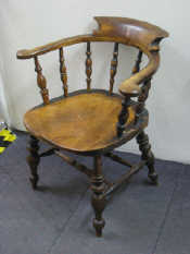 Appraisal: A Victorian smoker's chair of generous proportions elm seat good