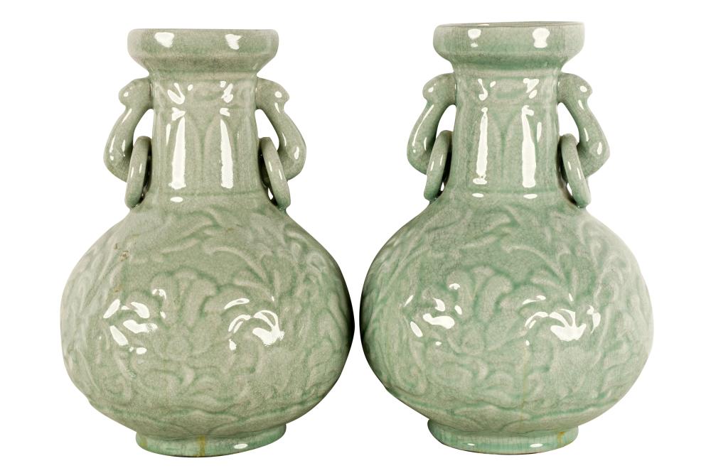 Appraisal: PAIR OF CELADON-GLAZED URNSCondition black fabric mounted to undersides inches