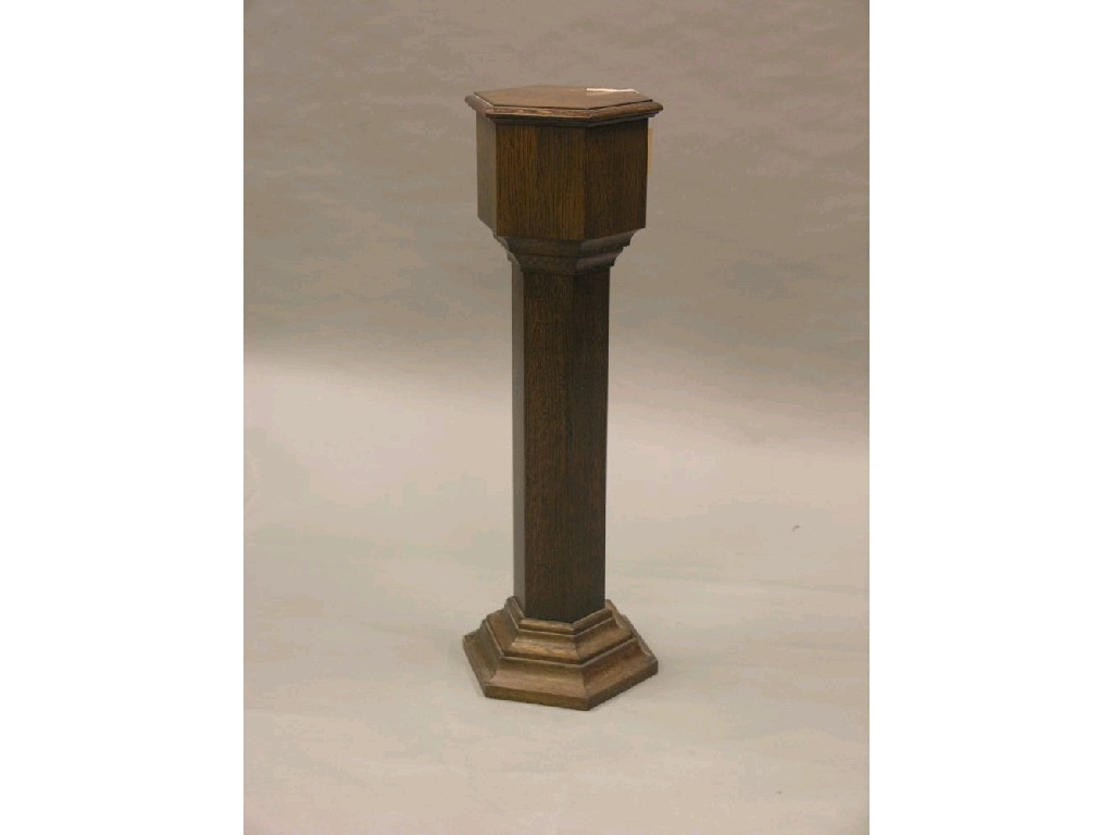 Appraisal: An oak baptismal font hexagonal shape with inset brass font