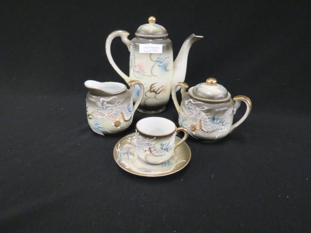 Appraisal: Japanese Moriage Porcelan Tea Set dragon decor includes teapot creamer