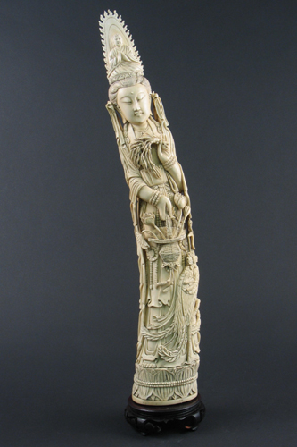 Appraisal: CHINESE IVORY ELEPHANT TUSK CARVING depicting Kwan Yin holding basket