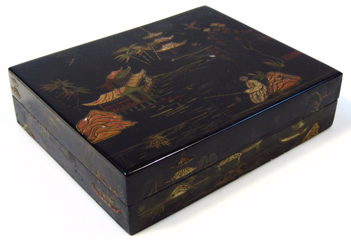 Appraisal: An oriental black lacquer travel box of rectangular outline with