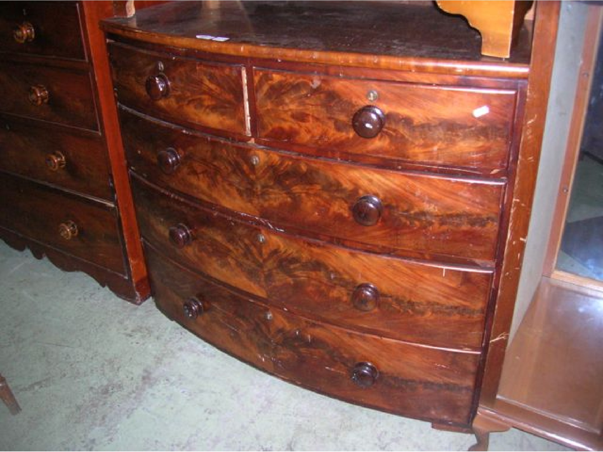 Appraisal: A th century mahogany bow fronted bedroom chest of three