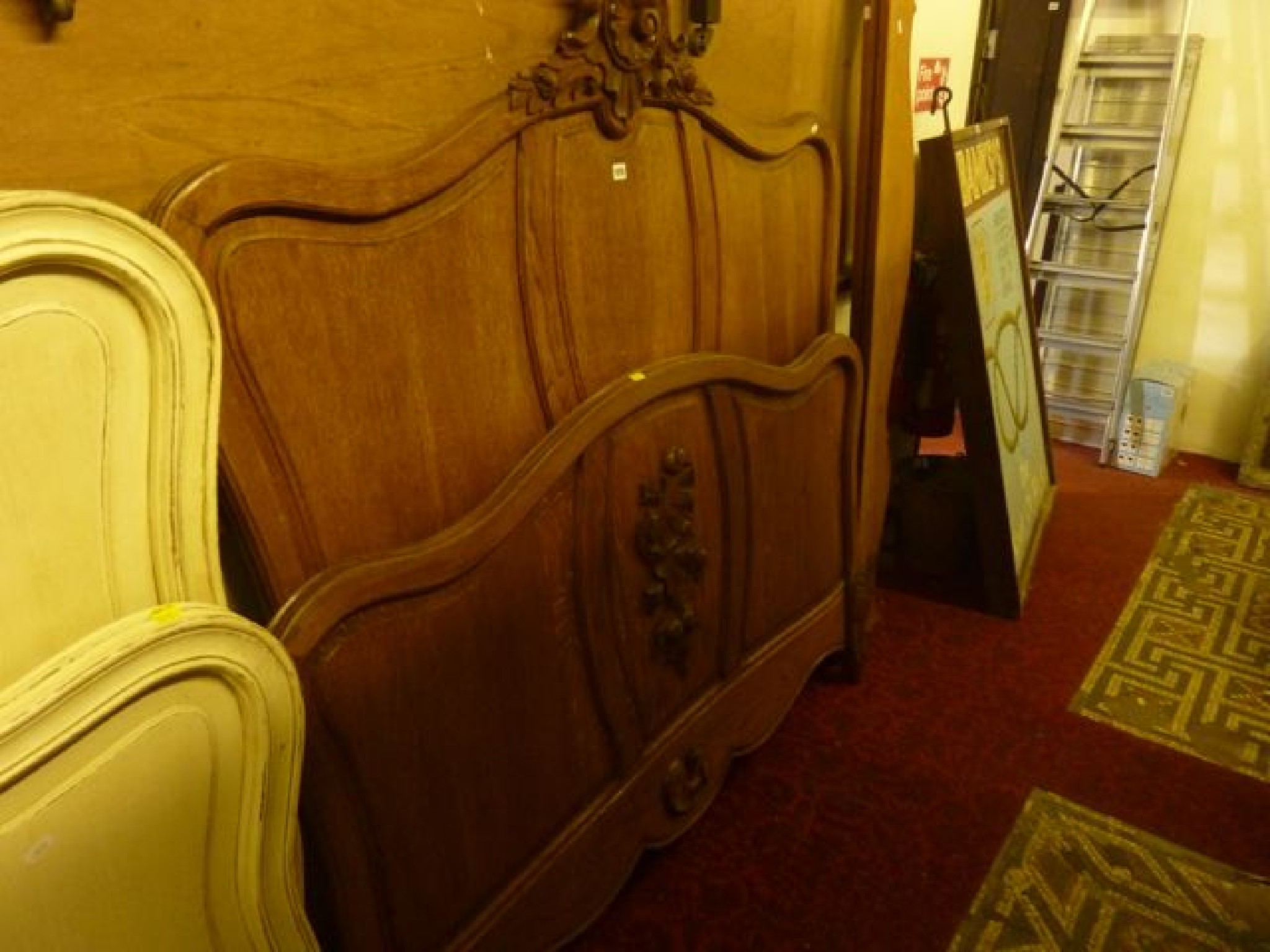 Appraisal: A continental oak double bedstead with shaped and moulded outline