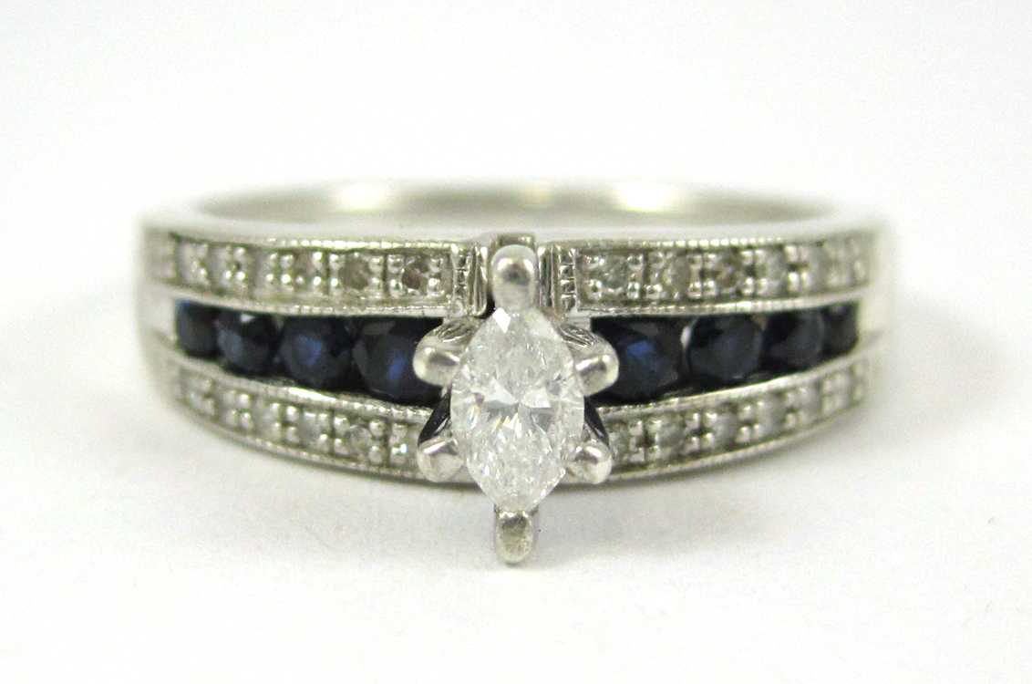 Appraisal: DIAMOND AND SAPPHIRE PLATINAIRE RING with eight round-cut sapphire and