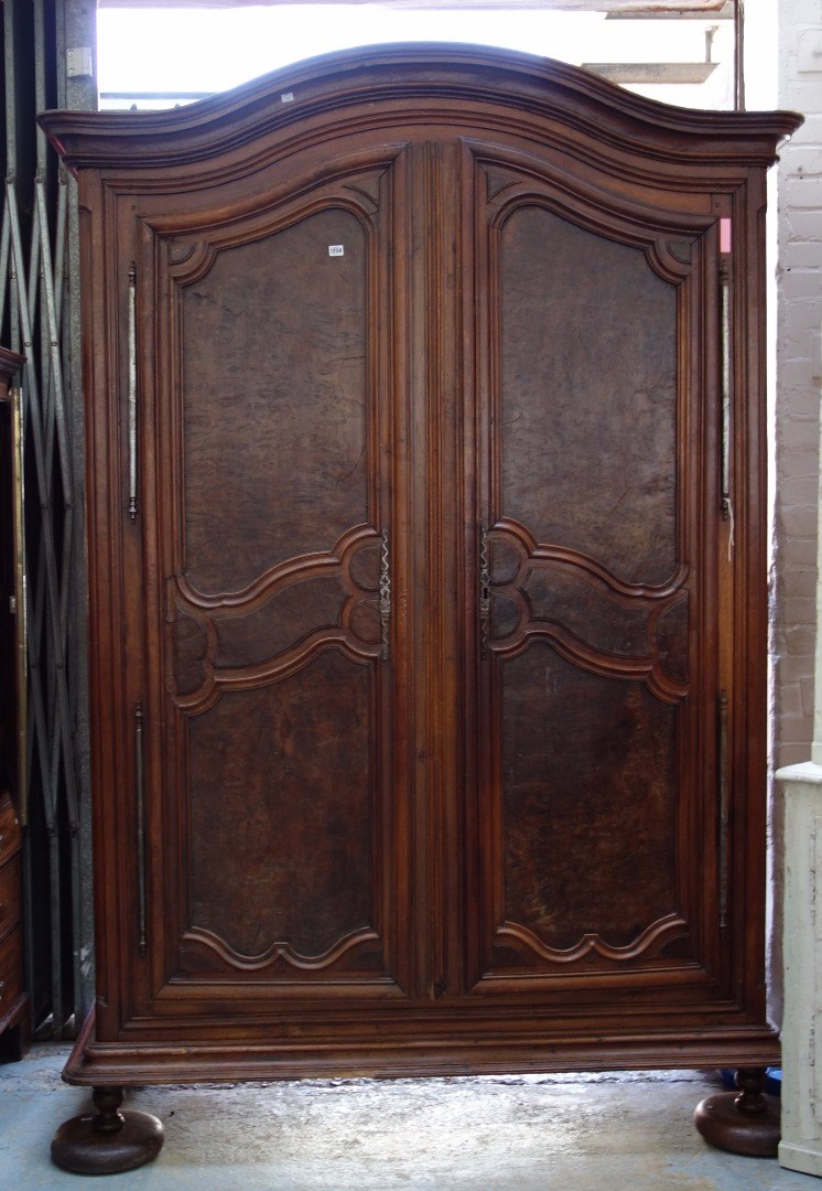 Appraisal: A large th century French oak and walnut two door