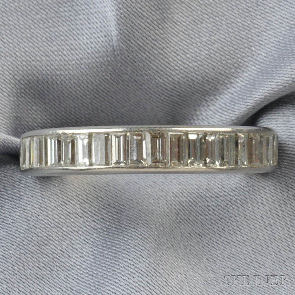 Appraisal: Platinum and Diamond Band channel-set with baguette-cut diamonds approx total