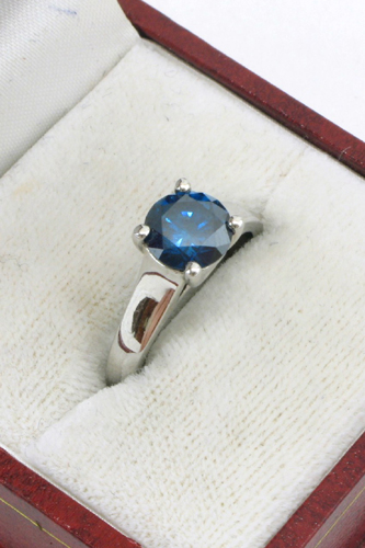 Appraisal: BLUE DIAMOND AND K WHITE GOLD RING WITH APPRAISAL centering