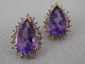 Appraisal: A pair of carat gold amethyst and diamond earrings approx