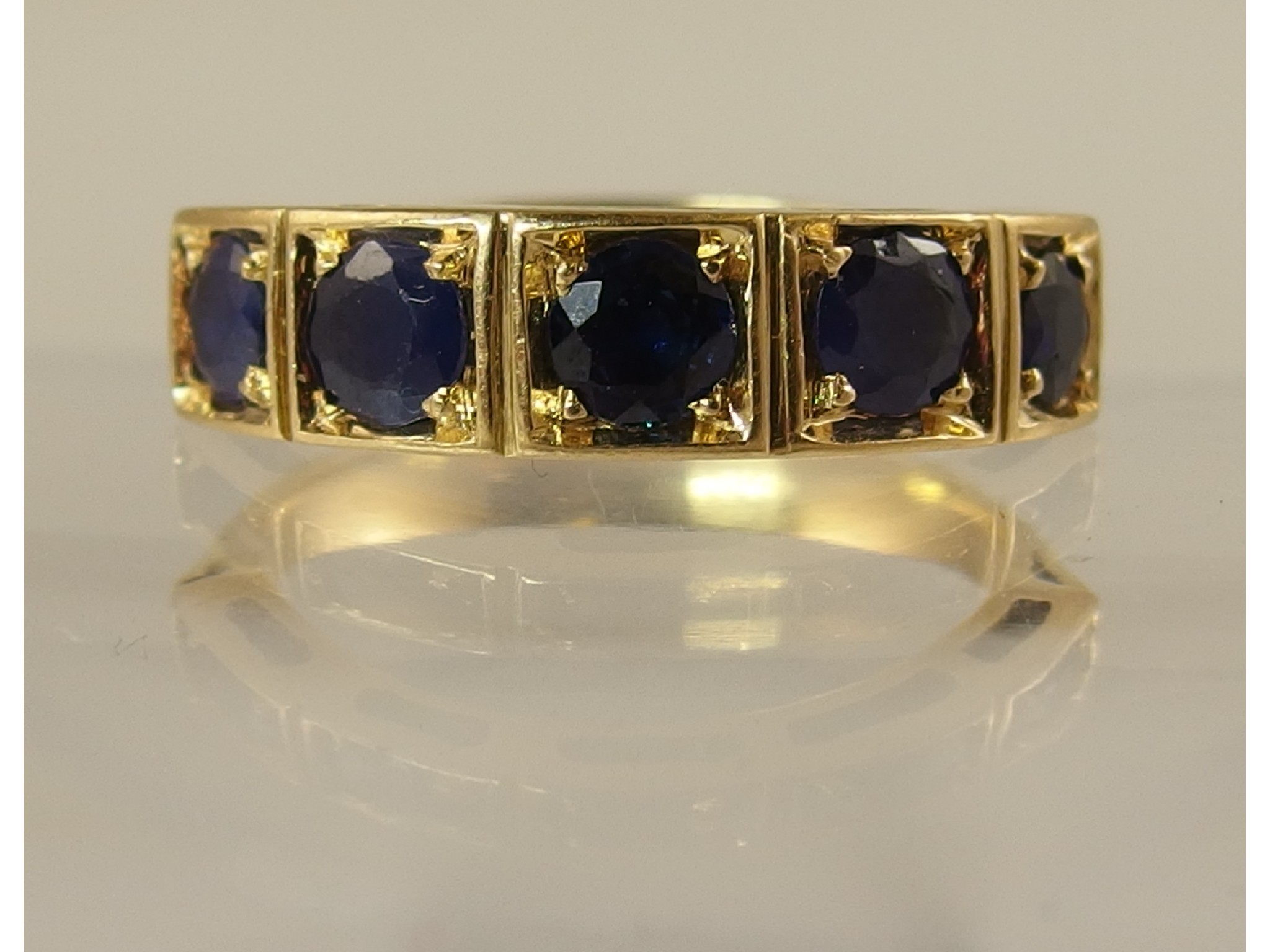 Appraisal: A yellow metal five stone sapphire ring