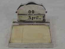 Appraisal: A silver calendar with composition writing pad hallmarked London