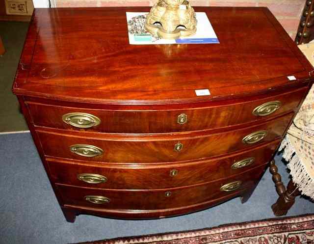 Appraisal: A REGENCY MAHOGANY BOW FRONT CHEST of four long graduated