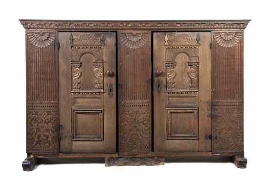 Appraisal: A Continental Carved Oak Cabinet having a rectangular top over