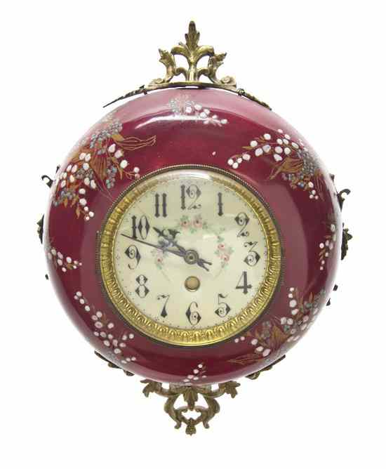 Appraisal: A Continental Enameled Wall Clock of circular form with foliate