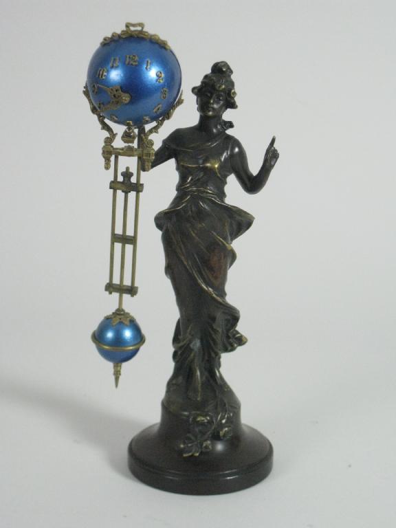 Appraisal: A French Mystery Clock in the form of a female