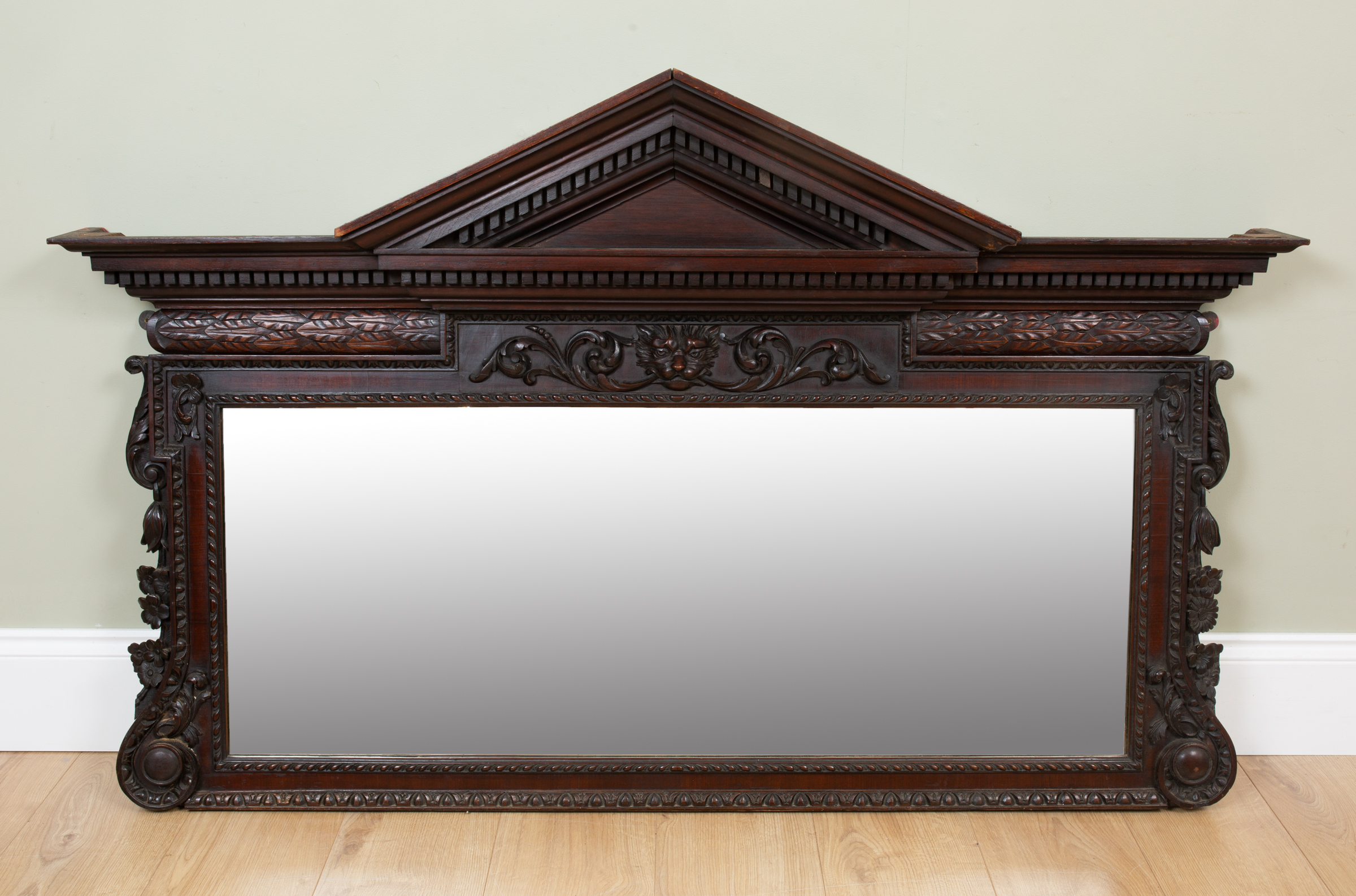 Appraisal: A mahogany overmantle mirror of architectural form the frieze centrally