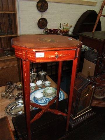 Appraisal: An Edwardian Satinwood wood work table with hand painted decoration