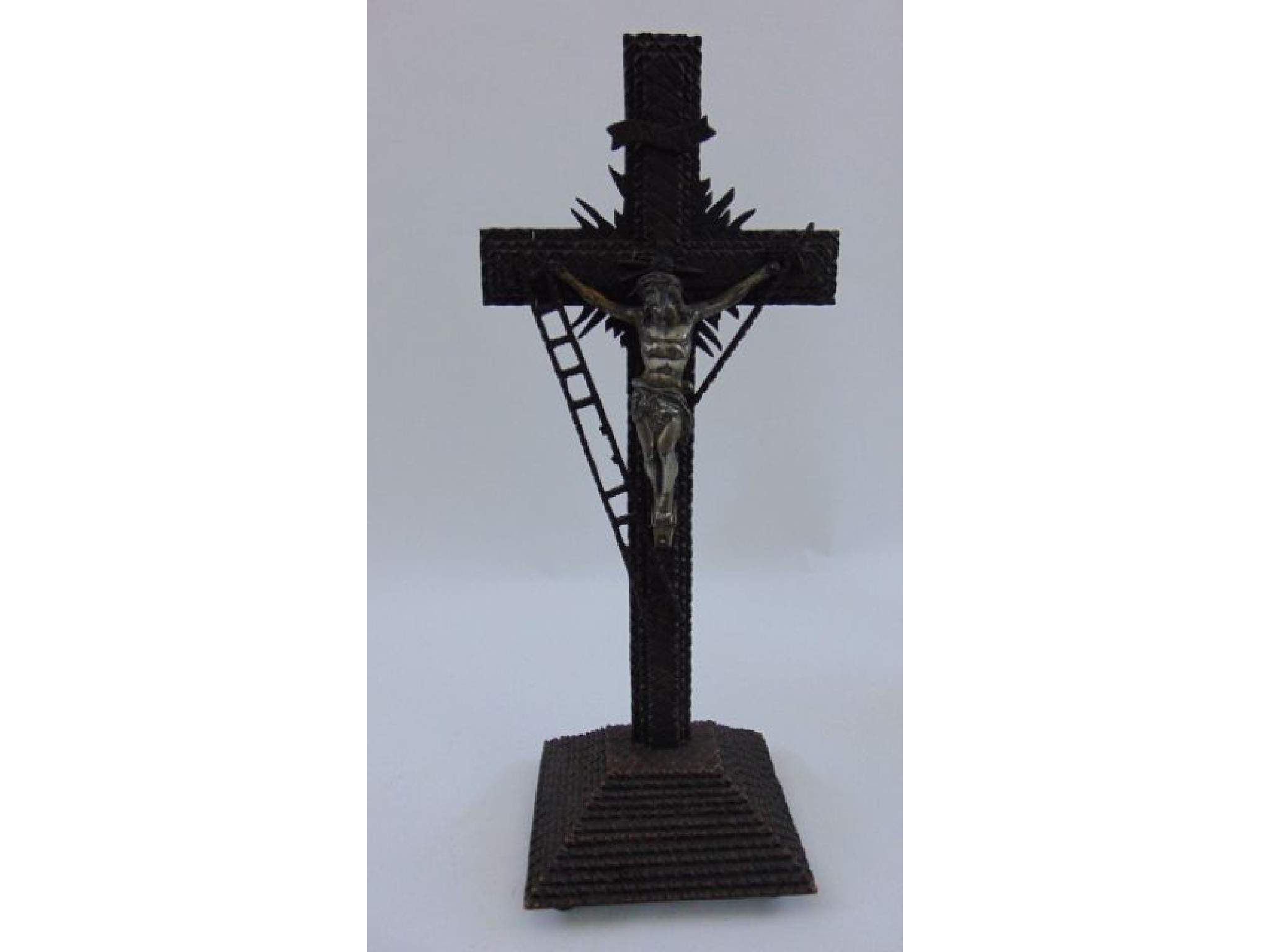 Appraisal: A th century tramp art crucifix set on a pyramid