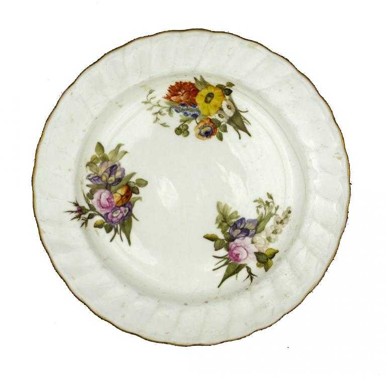 Appraisal: A PINXTON PLATE enamelled with three flower sprays two including