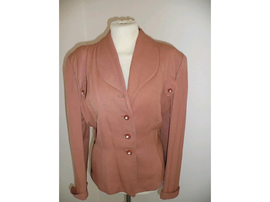 Appraisal: A 's jacket in salmon padded shoulder turnback cuffs decorative