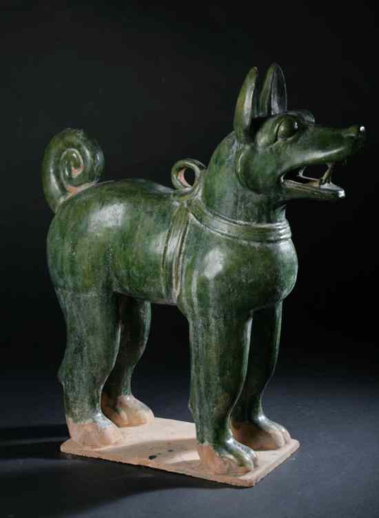 Appraisal: CHINESE GREEN GLAZED POTTERY FIGURE OF DOG Possibly Ming dynasty