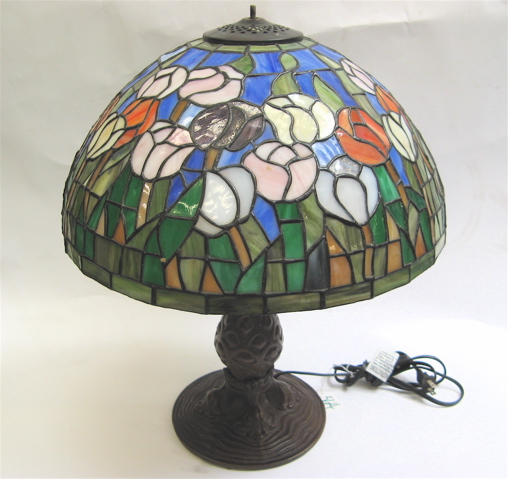 Appraisal: STAINED AND LEADED GLASS TABLE LAMP the shade in colorful