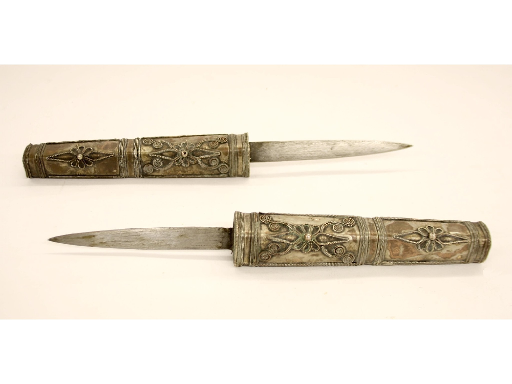 Appraisal: Interesting Indian white metal double-blade dagger long