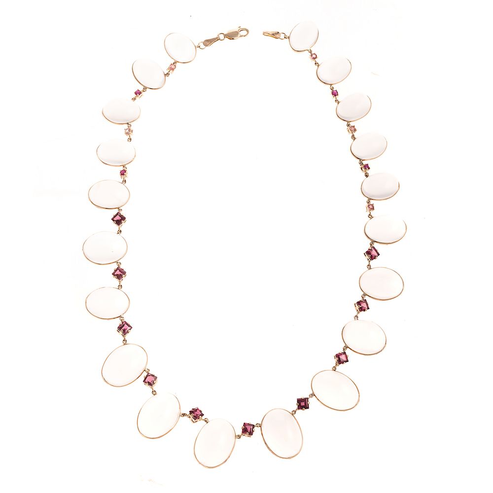 Appraisal: A Graduated Moonstone Ruby Station Necklace K yellow gold necklace