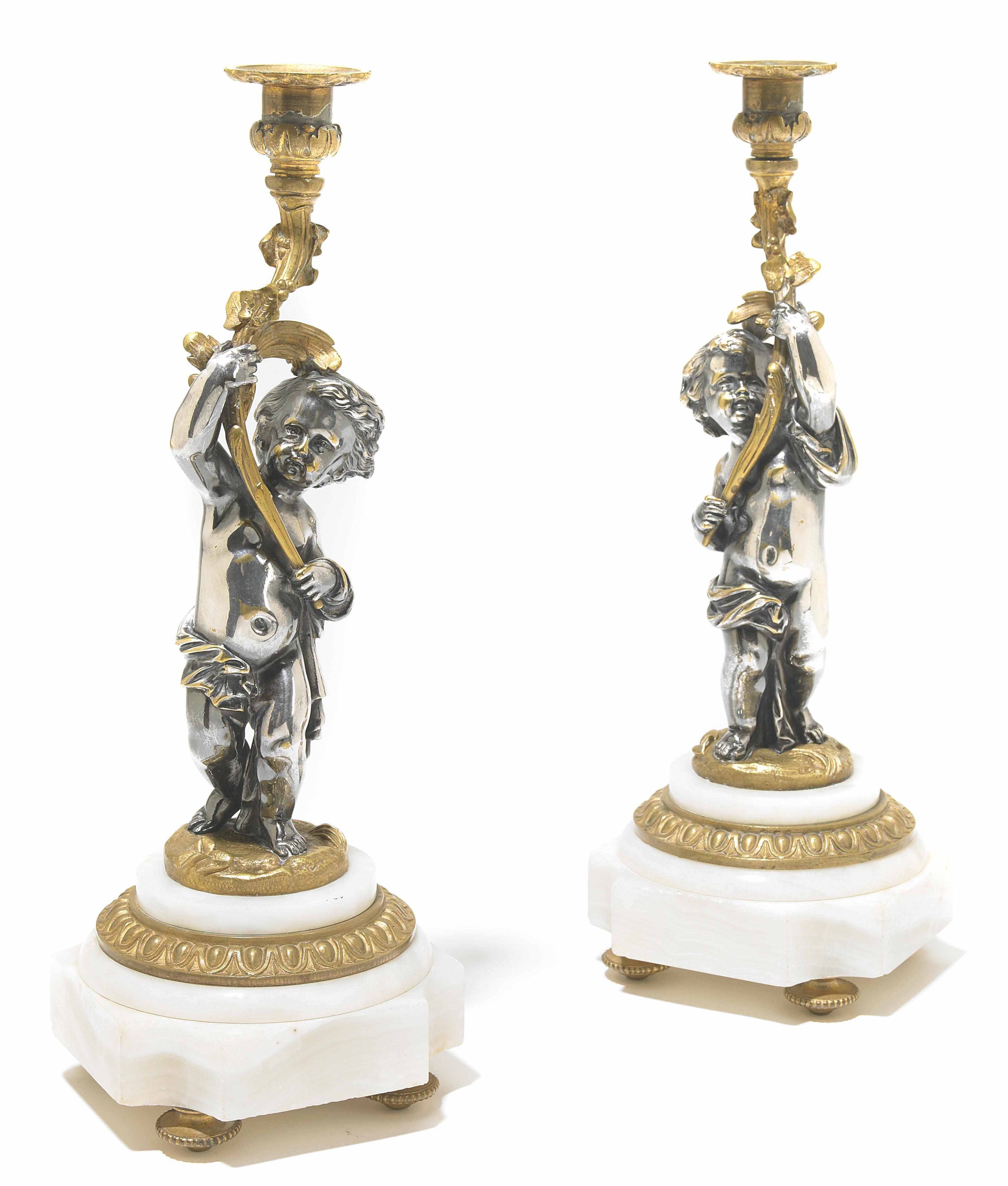 Appraisal: A pair of Louis XV style gilt and silvered bronze